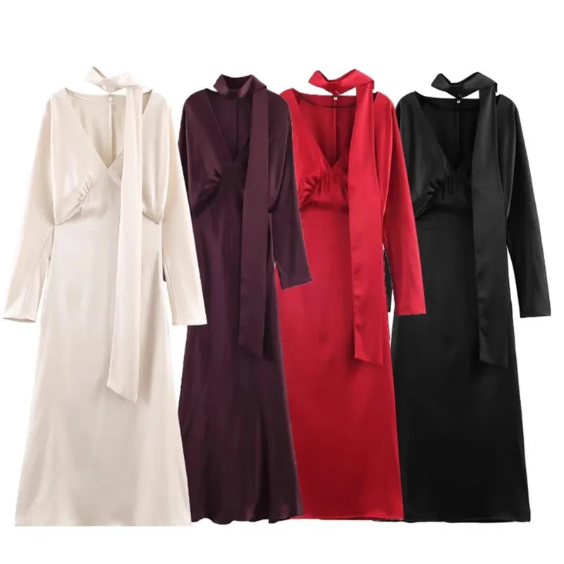 Robe longue élégante unie à col en V et manches longues, Collection printemps 2026. Coupe chic et ajustée.